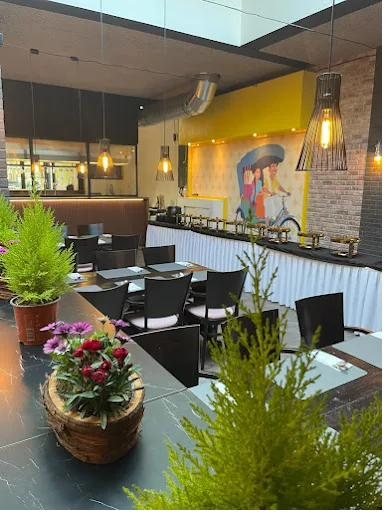 Set tables in our dining room under the rickshaw mural